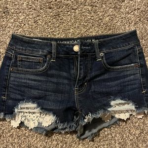 Shorts with lace pockets